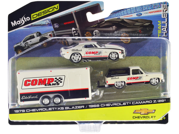 1979 Chevrolet K5 Blazer White and Black and 1968 Chevrolet Camaro Z/28 White with Stripes with Enclosed Car Trailer "Comp Cams - Edlebrock" "Team Haulers" Series 1/64 Diecast Model Car by Maisto