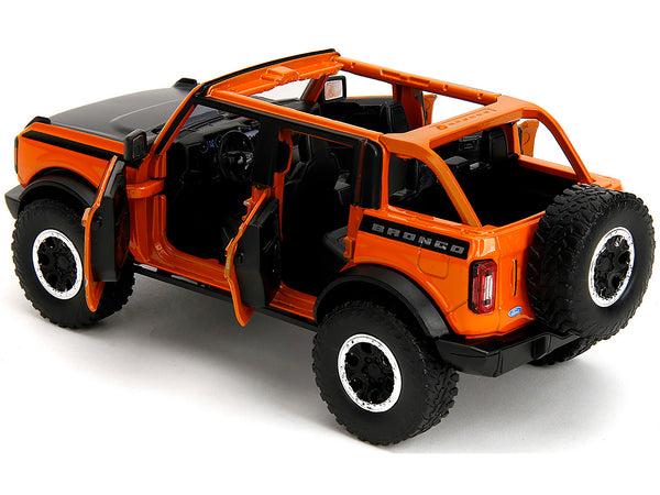 2021 Ford Bronco Open-Top Orange with Black Stripes and Hood with Extra Wheels "Just Trucks" Series 1/24 Diecast Model Car by Jada