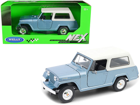 1967 Jeep Jeepster Commando Station Wagon Light Blue Metallic with White Top "NEX Models" Series 1/24 Diecast Model Car by Welly