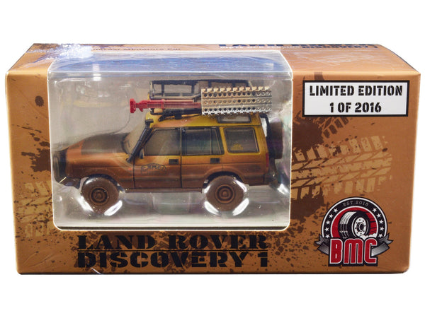 Land Rover Discovery 1 RHD (Right Hand Drive) "Camel Trophy" Yellow (Dirty Mud Version) with Roof Rack Extra Wheels and Accessories Limited Edition to 2016 pieces Worldwide 1/64 Diecast Model Car by BM Creations