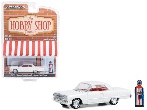 1963 Chevrolet Bel Air White with Orange Interior and Vintage Gas Pump "The Hobby Shop" Series 15 1/64 Diecast Model Car by Greenlight