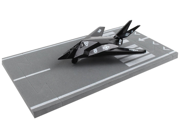 Lockheed F-117 Nighthawk Stealth Aircraft Black "United States Air Force" with Runway Section Diecast Model Airplane by Runway24